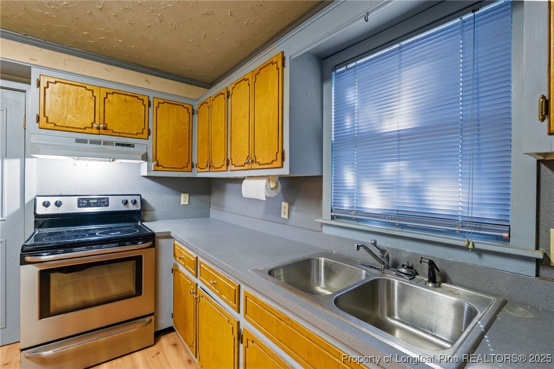 1430 Cypress Church Road Cameron, NC 28326 - Photo 13 of 42 a kitchen that has a sink and a stove