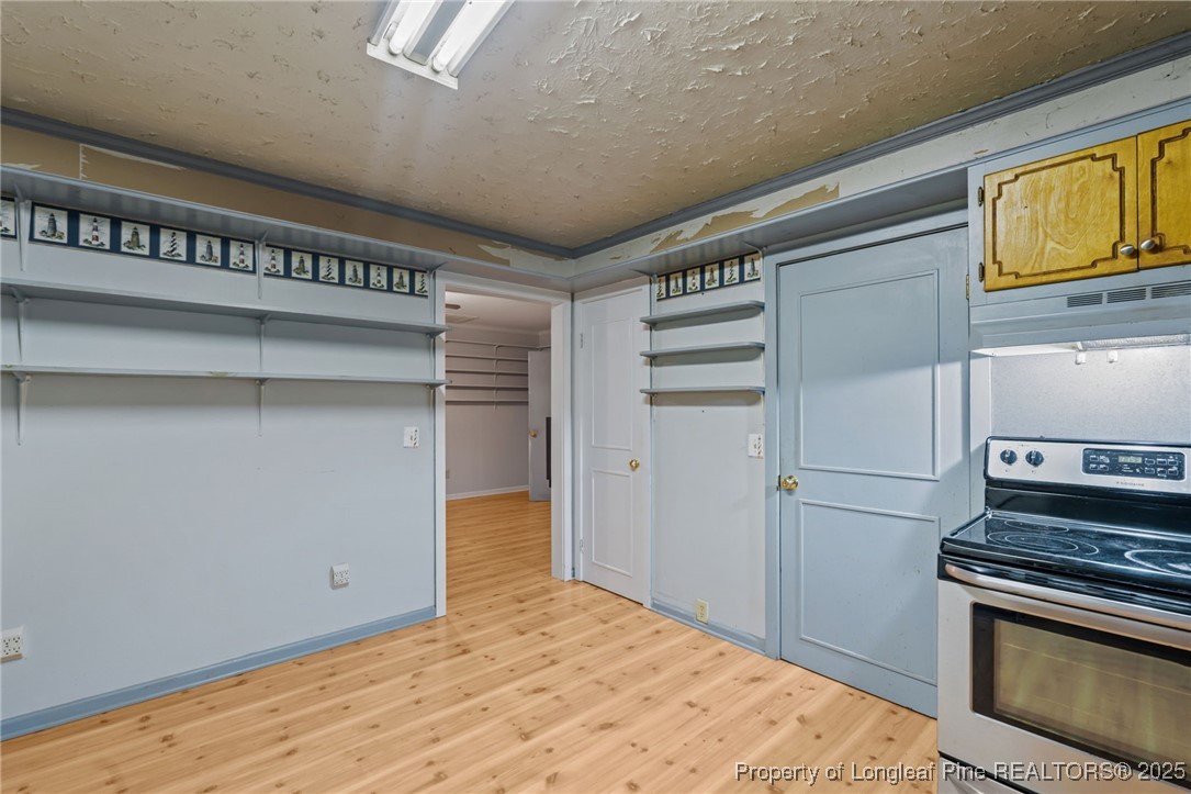 1430 Cypress Church Road Cameron, NC 28326 - Photo 15 of 42 a kitchen with a stove and a refrigerator