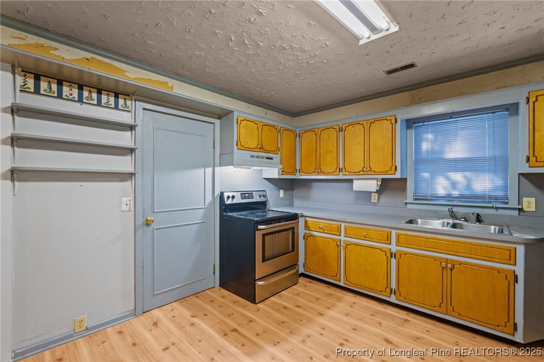 1430 Cypress Church Road Cameron, NC 28326 - Photo 17 of 42 a kitchen with stainless steel appliances granite countertop a refrigerator a sink dishwasher stove and oven