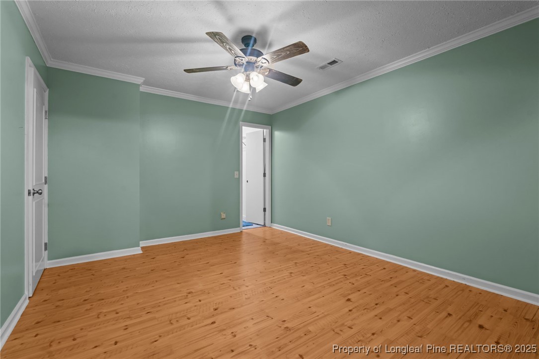 1430 Cypress Church Road Cameron, NC 28326 - Photo 23 of 42 a view of an empty room with wooden floor
