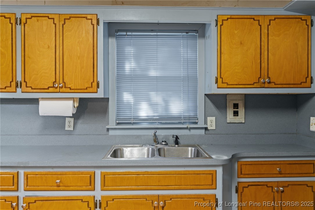 1430 Cypress Church Road Cameron, NC 28326 - Photo 26 of 42 a bathroom with a sink and a mirror