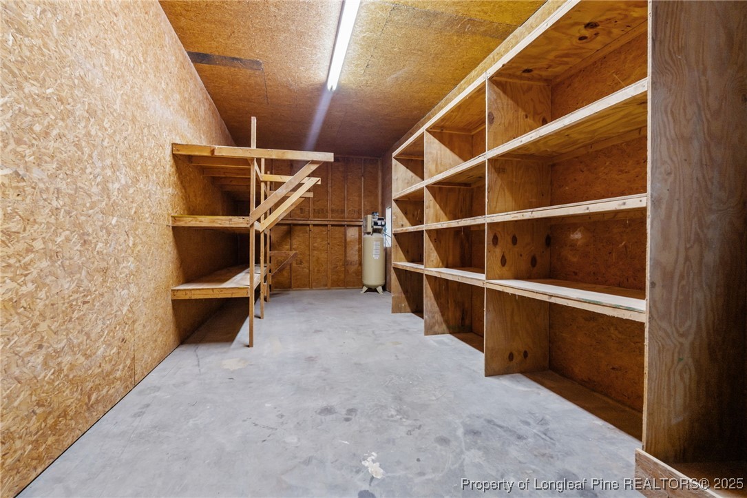 1430 Cypress Church Road Cameron, NC 28326 - Photo 33 of 42 a view of an empty room with empty shelves