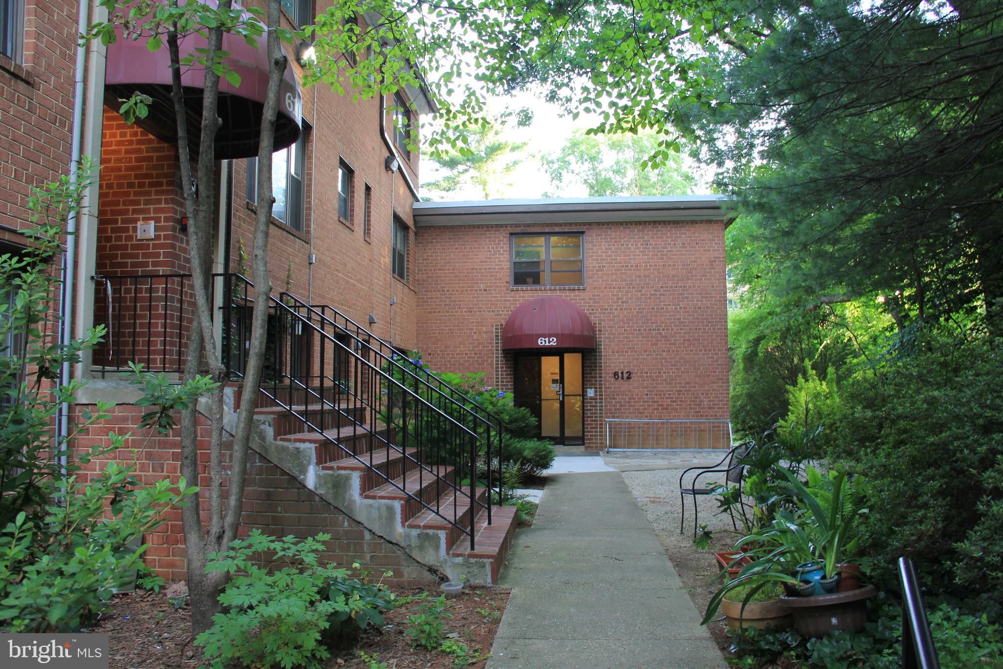 610 Kennebec Avenue, Unit B2 Takoma Park, MD 20912 - Photo 1 of 8 a front view of house with yard and green space