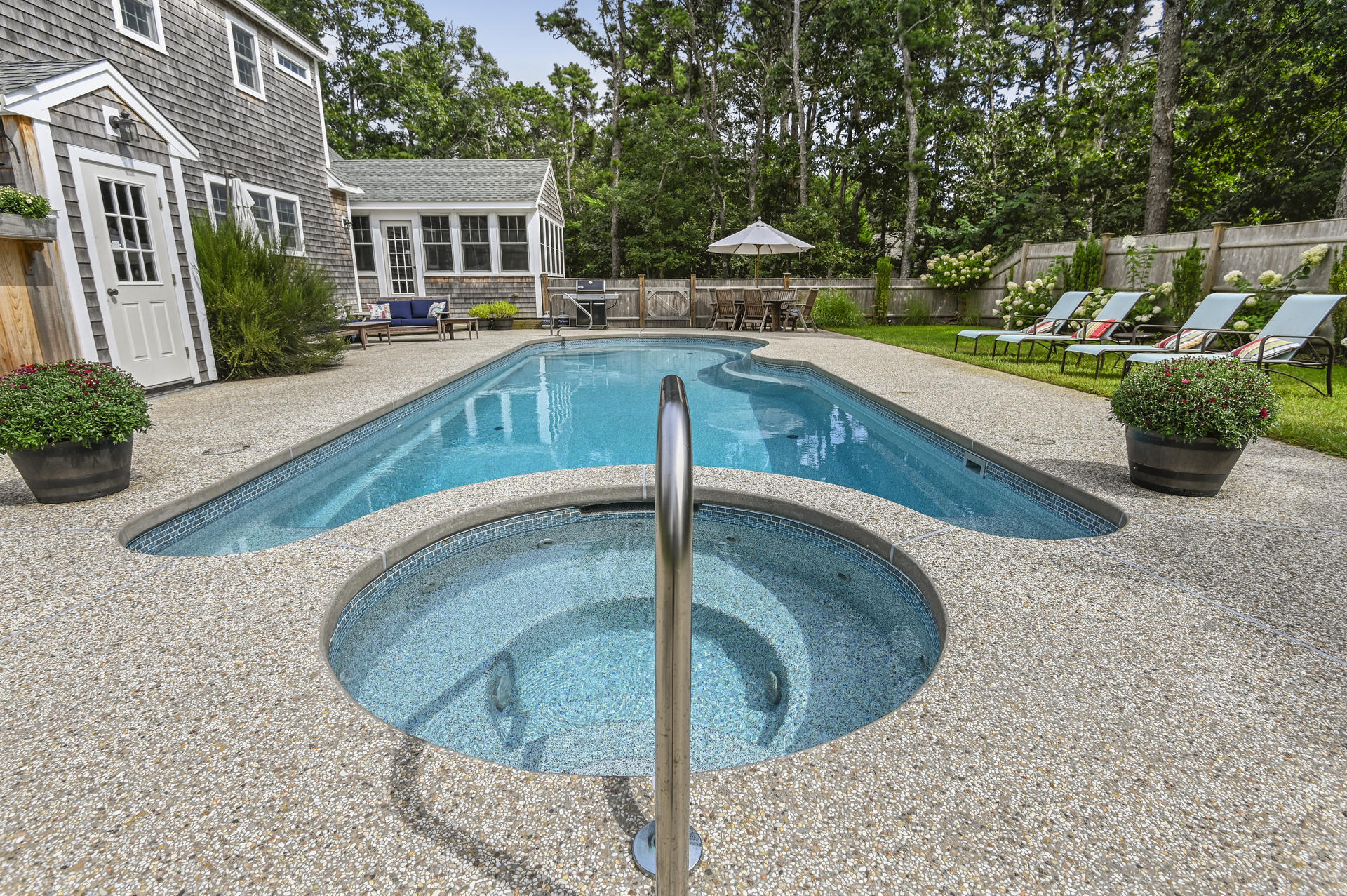 20 Hughes Road Eastham, MA 02642 - Photo 18 of 20 a view of a swimming pool with a patio