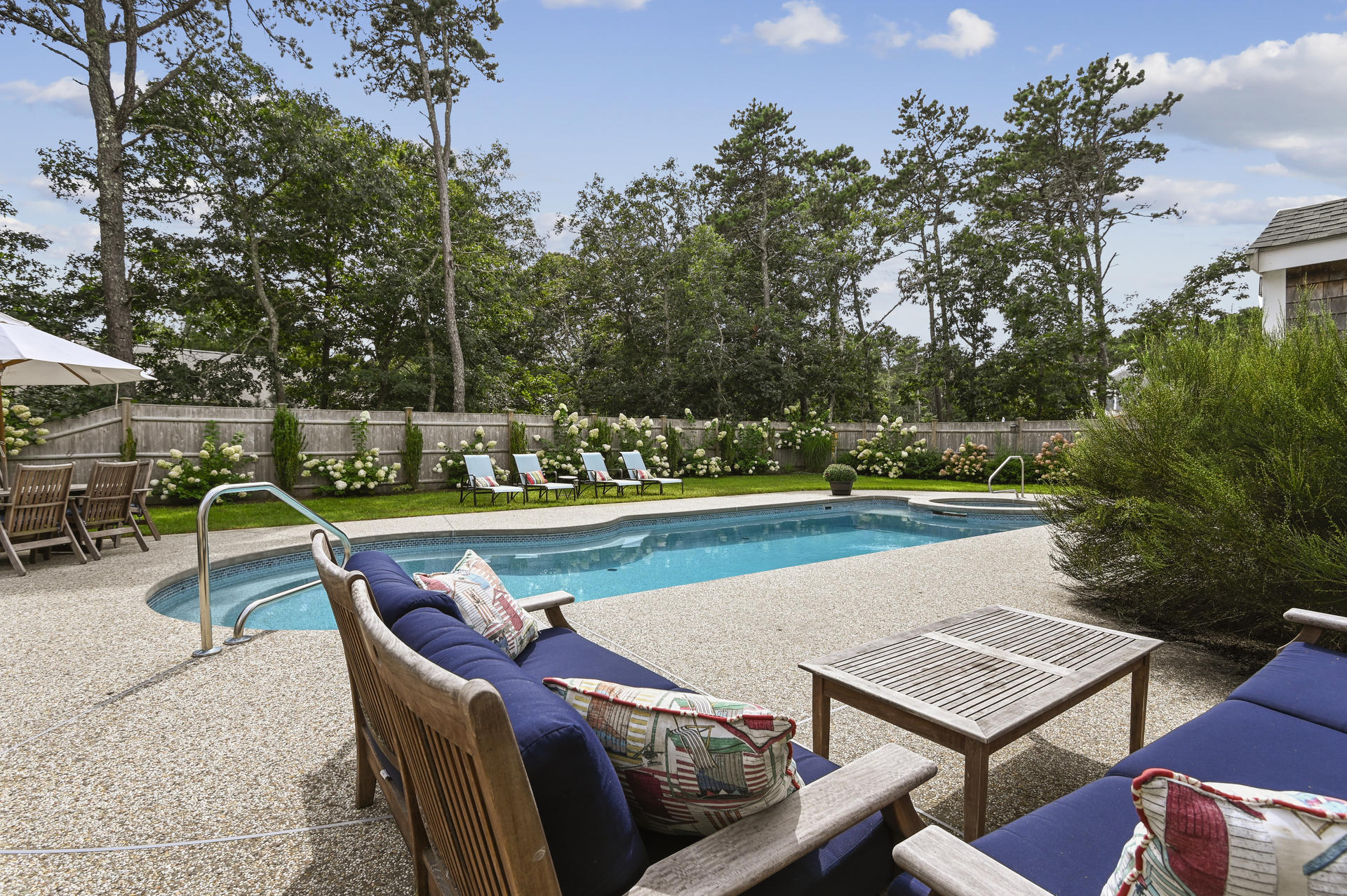 20 Hughes Road Eastham, MA 02642 - Photo 20 of 20 an outdoor space with swimming pool and furniture