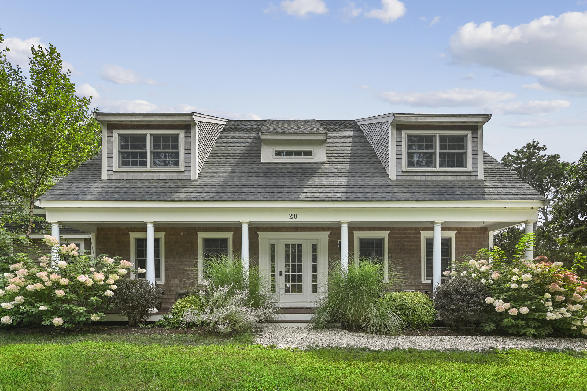 20 Hughes Road Eastham, MA 02642 - Photo 2 of 20 front view of a house with a yard