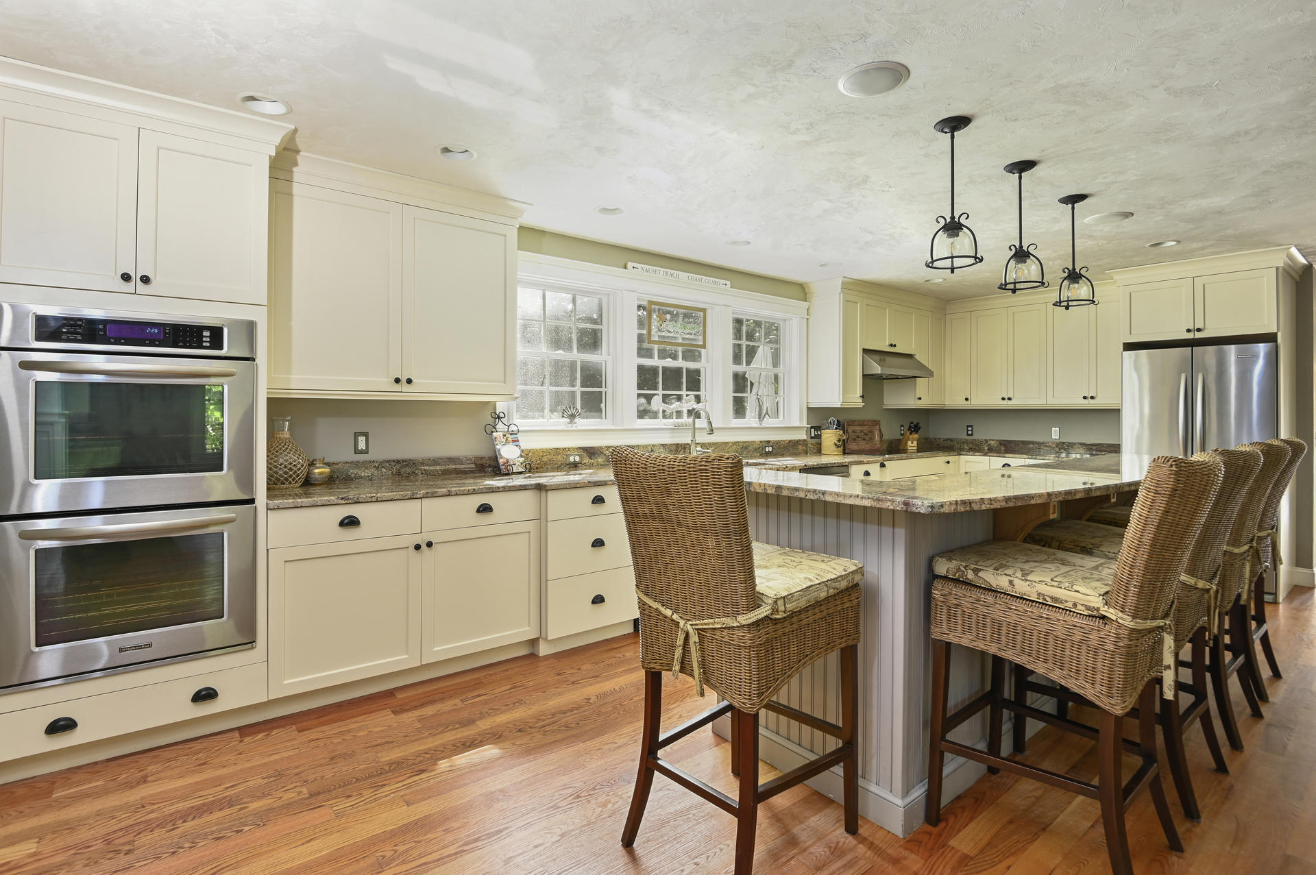 20 Hughes Road Eastham, MA 02642 - Photo 5 of 20 a kitchen with a stove cabinets and chairs