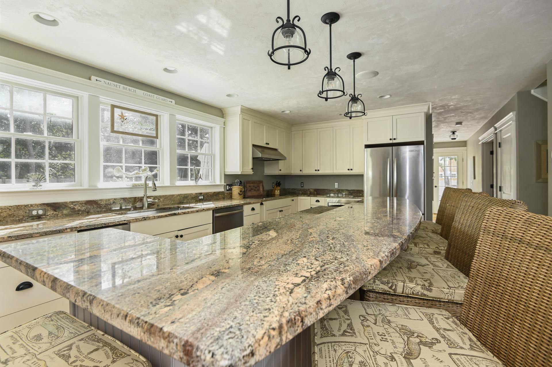 20 Hughes Road Eastham, MA 02642 - Photo 6 of 20 a large white kitchen with kitchen island granite countertop a large counter top appliances and cabinets