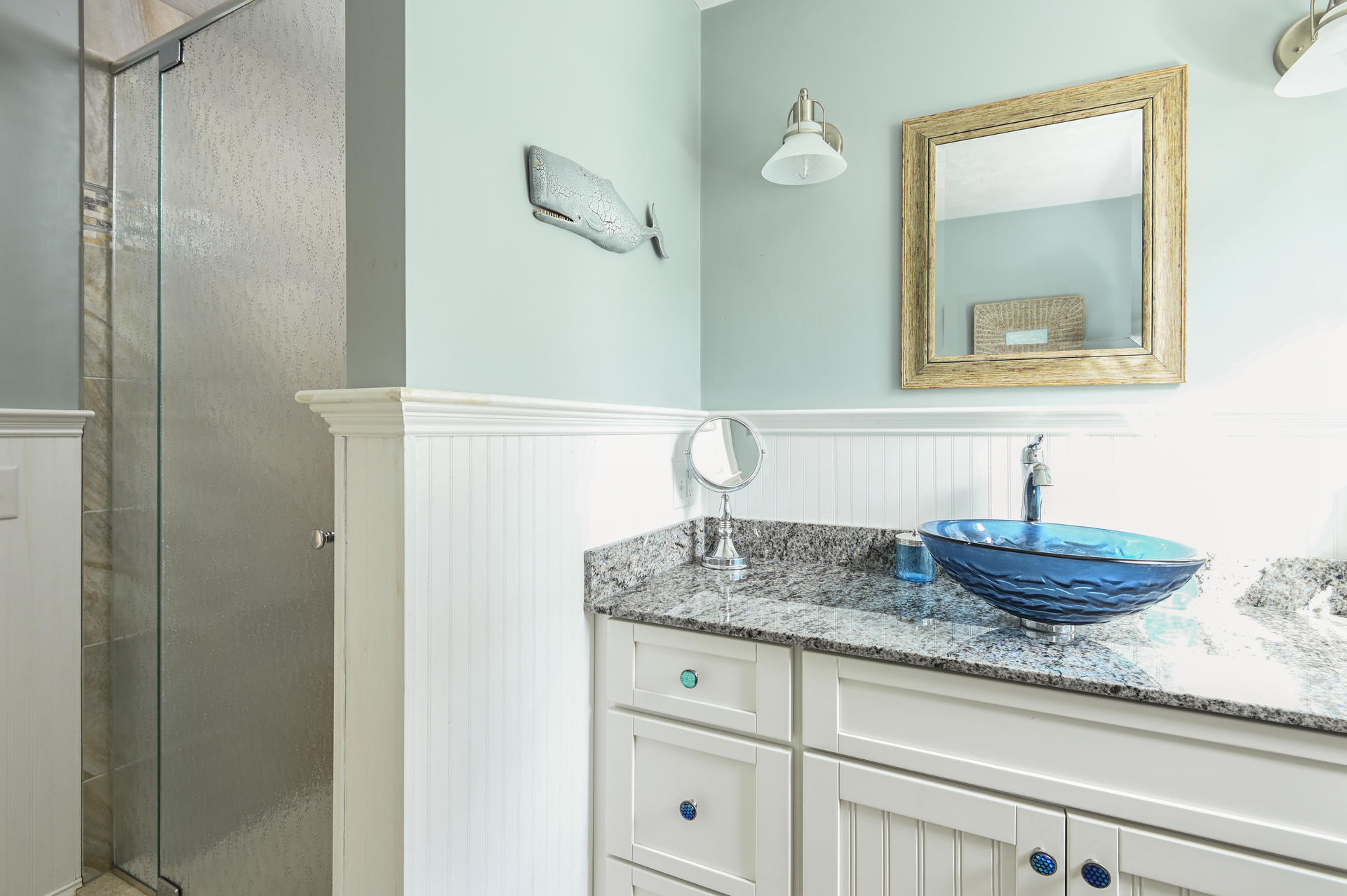 20 Hughes Road Eastham, MA 02642 - Photo 10 of 20 a bathroom with a granite countertop sink and a mirror