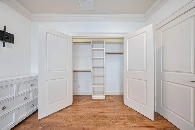 a view of closet area with empty racks
