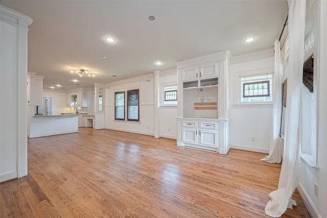 a view of a kitchen with wooden floor and a kitchen