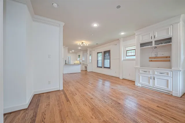 a view of kitchen with refrigerator and a window