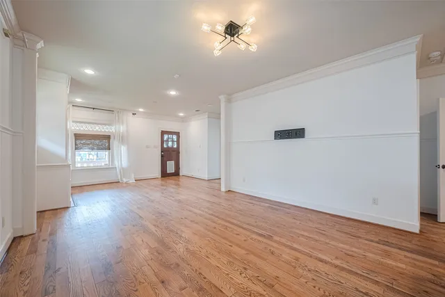 a view of a kitchen with wooden floor and a kitchen