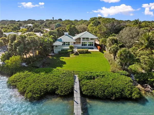 front view of a house with a swimming pool