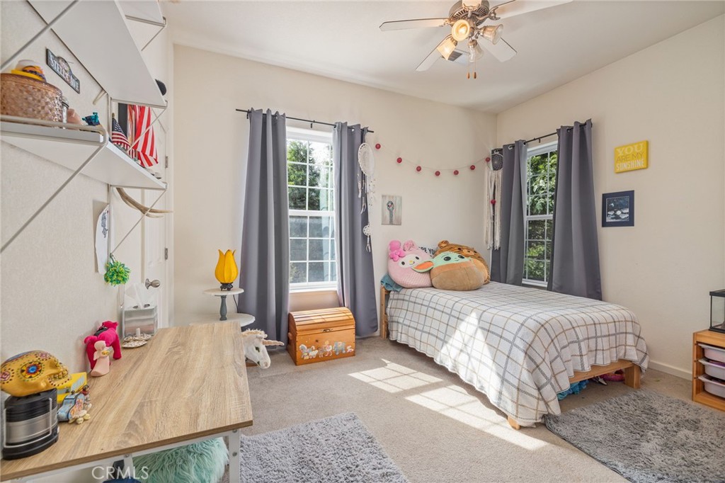 36919 Deer Path Circle Coarsegold, CA 93614 - Photo 25 of 59 a bedroom with bed and window