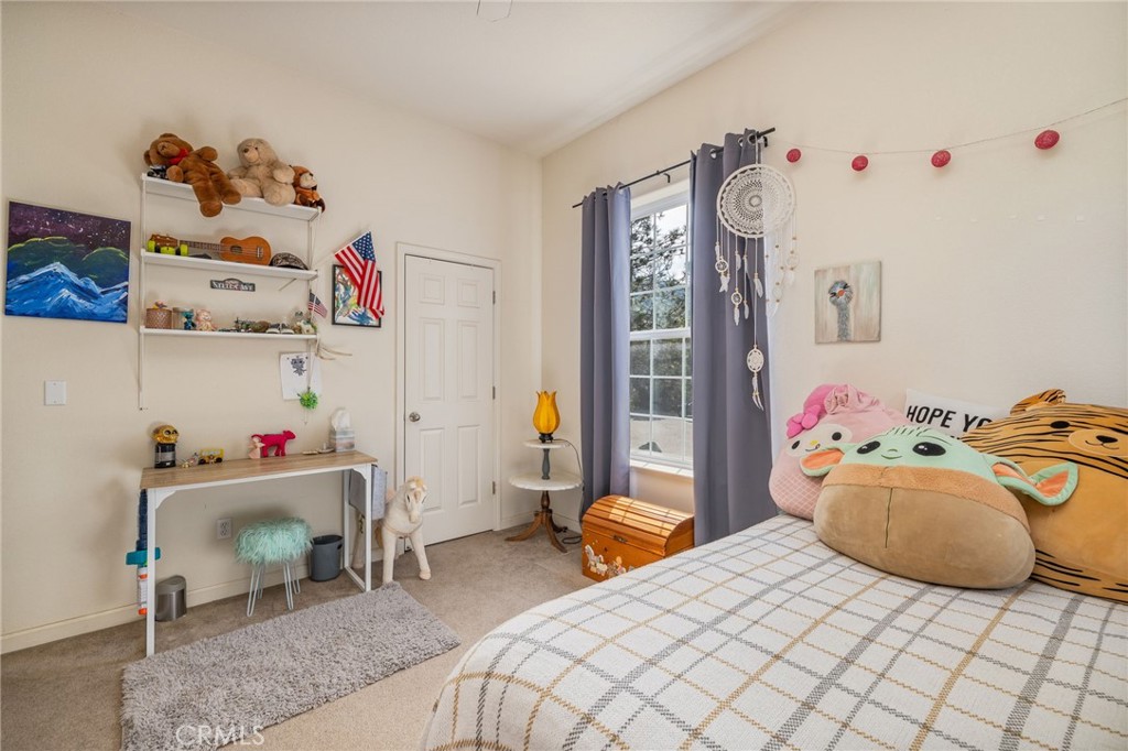 36919 Deer Path Circle Coarsegold, CA 93614 - Photo 26 of 59 a bedroom with furniture and a bed