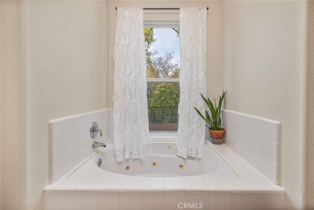 36919 Deer Path Circle Coarsegold, CA 93614 - Photo 31 of 59 a white bath tub with a shower