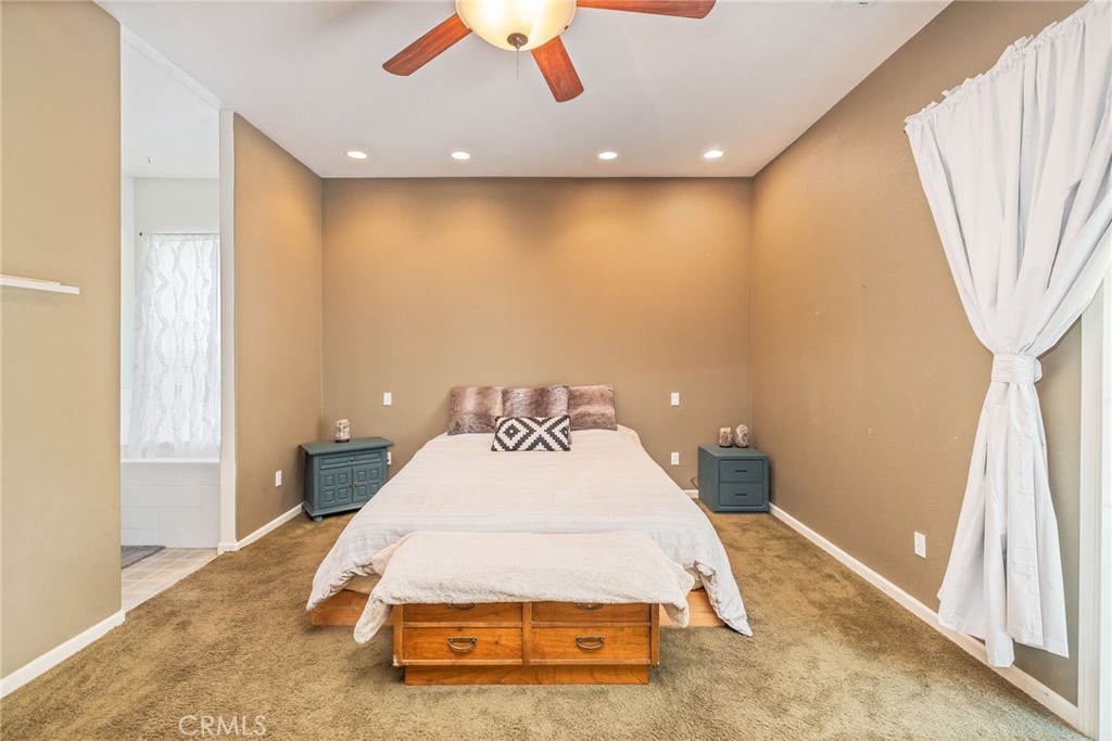 36919 Deer Path Circle Coarsegold, CA 93614 - Photo 33 of 59 a bedroom with a bed and a large window