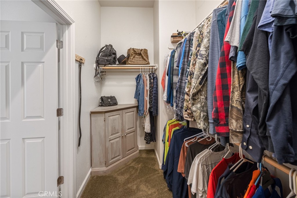 36919 Deer Path Circle Coarsegold, CA 93614 - Photo 36 of 59 a view of walk in closet with clothes and shoes