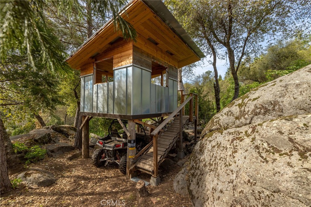 36919 Deer Path Circle Coarsegold, CA 93614 - Photo 45 of 59 a front view of a house with garden