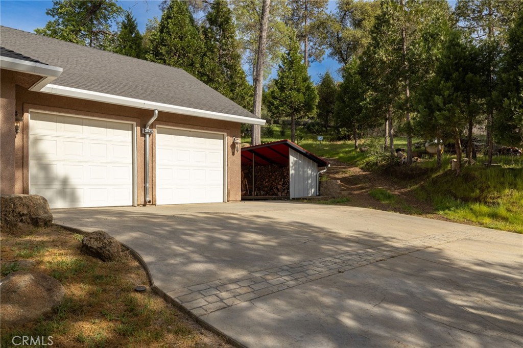 36919 Deer Path Circle Coarsegold, CA 93614 - Photo 5 of 59 a view of a backyard of a house