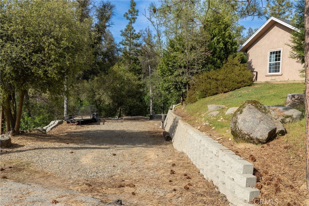 36919 Deer Path Circle Coarsegold, CA 93614 - Photo 6 of 59 a view of a backyard with a tub