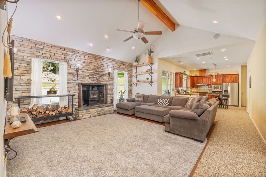 36919 Deer Path Circle Coarsegold, CA 93614 - Photo 8 of 59 a living room with furniture and a fireplace