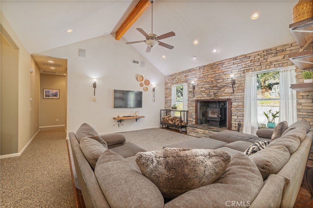 36919 Deer Path Circle Coarsegold, CA 93614 - Photo 9 of 59 a living room with furniture and a fireplace