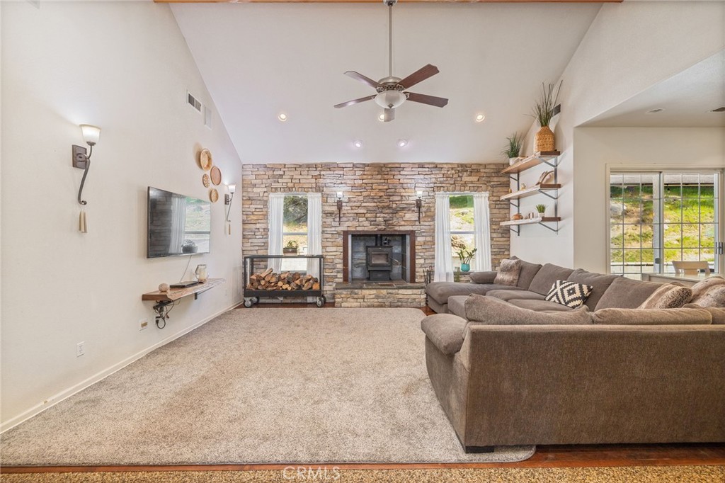 36919 Deer Path Circle Coarsegold, CA 93614 - Photo 10 of 59 a living room with furniture and a fireplace