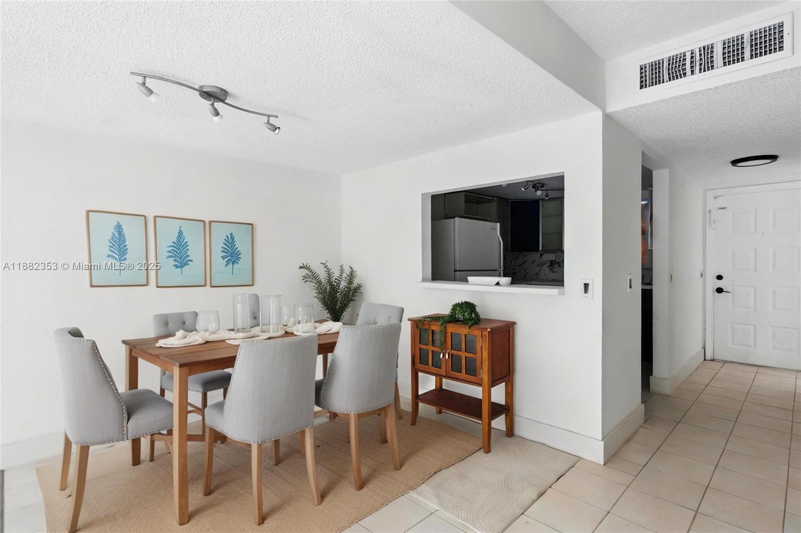 4165 Southwest 66th Terrace, Unit 109 Davie, FL 33314 - Photo 13 of 31 a view of a dining room with furniture and wooden floor