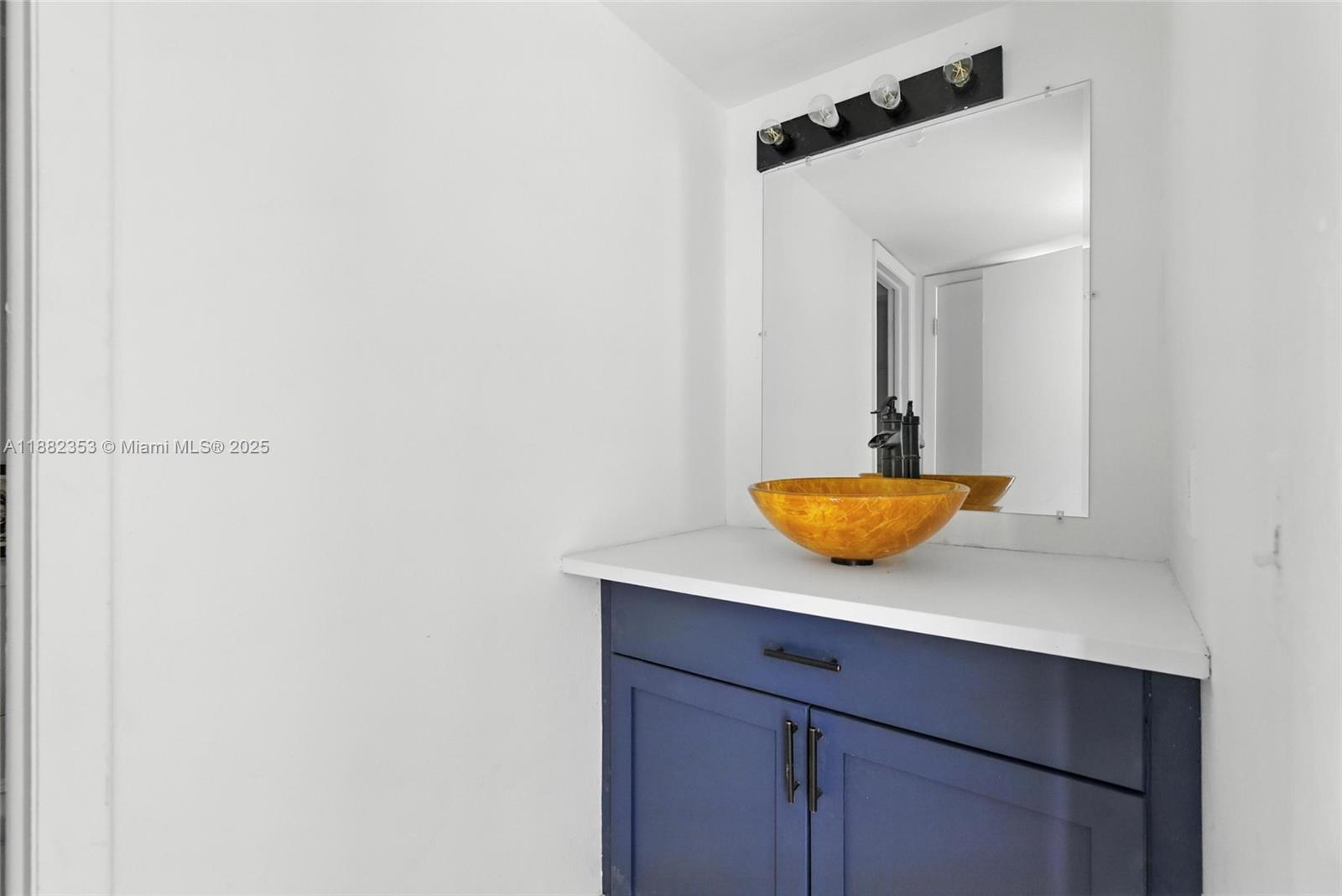4165 Southwest 66th Terrace, Unit 109 Davie, FL 33314 - Photo 17 of 31 a view of bathroom with a sink and mirror
