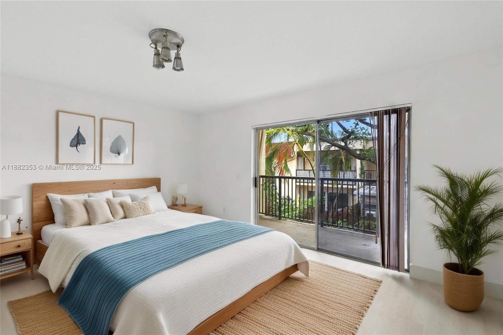 4165 Southwest 66th Terrace, Unit 109 Davie, FL 33314 - Photo 18 of 31 a bedroom with a large bed and a window