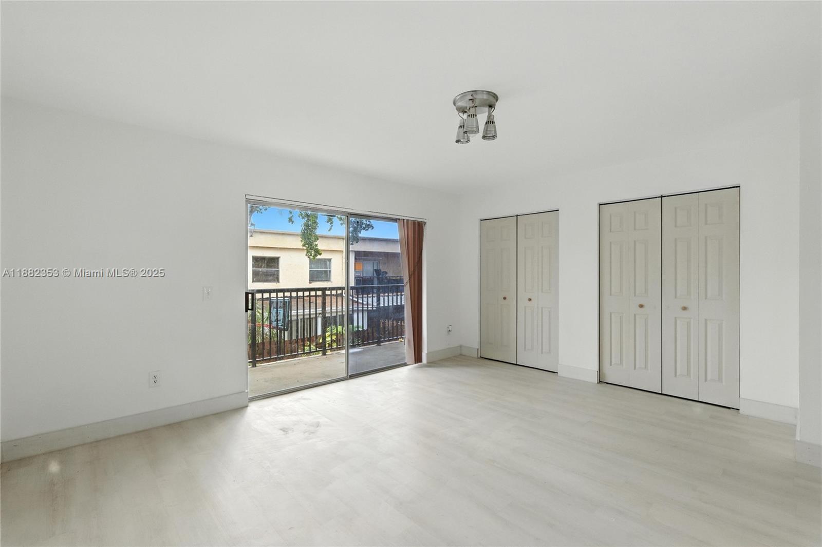 4165 Southwest 66th Terrace, Unit 109 Davie, FL 33314 - Photo 19 of 31 a view of an empty room with a window