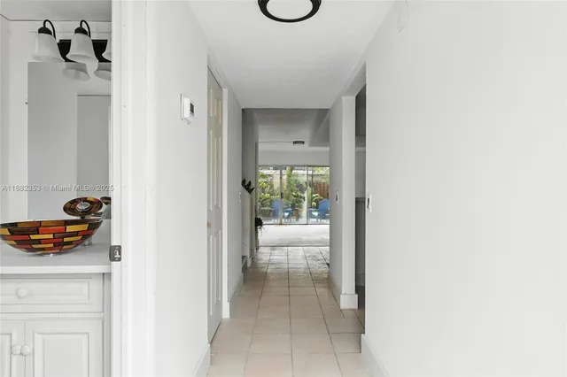 a view of a bathroom with a sink and mirror