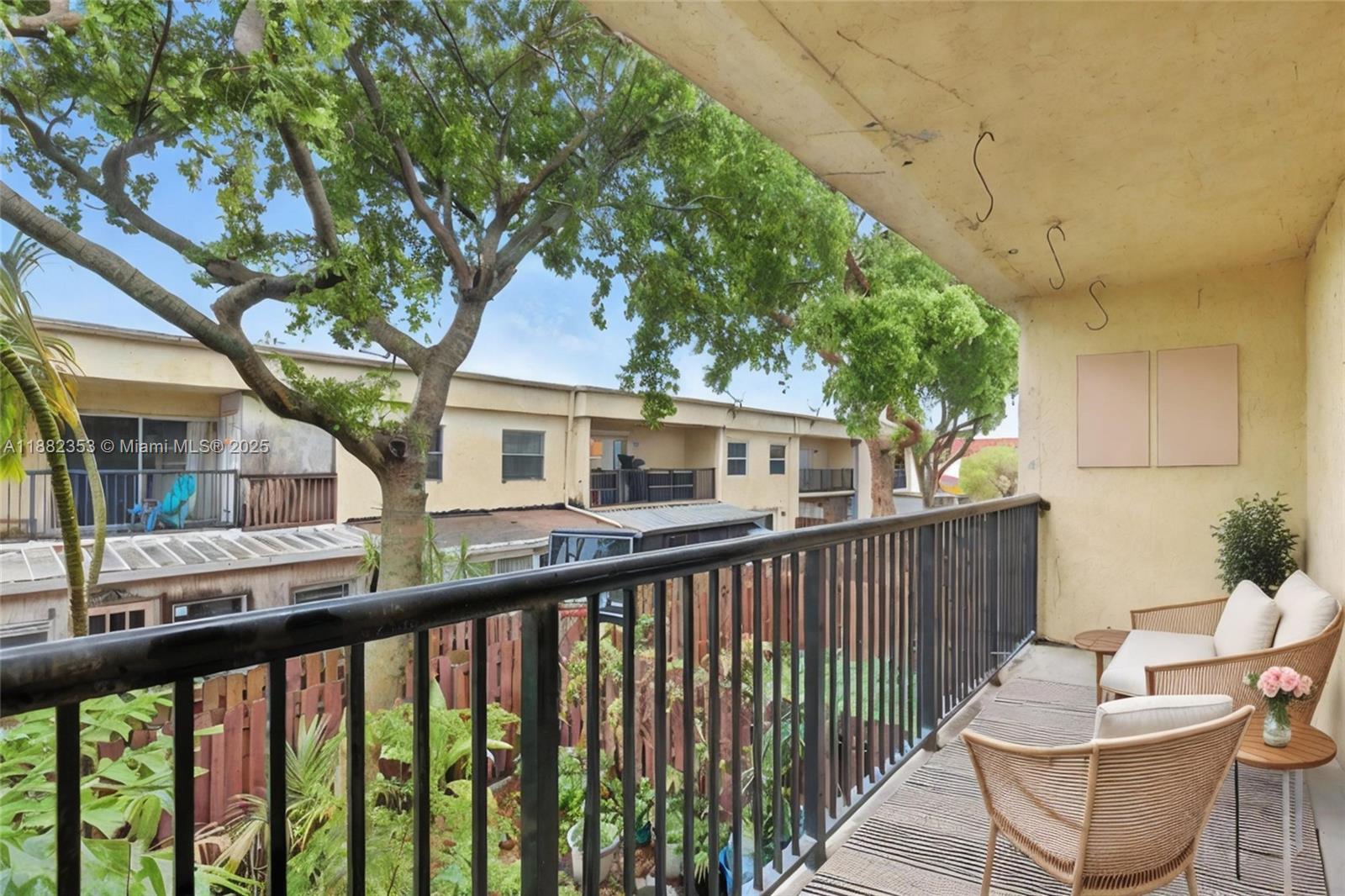 4165 Southwest 66th Terrace, Unit 109 Davie, FL 33314 - Photo 24 of 31 a view of a two chair in the balcony