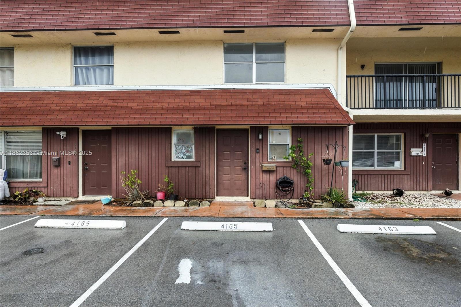 4165 Southwest 66th Terrace, Unit 109 Davie, FL 33314 - Photo 31 of 31 a view of a building with a large windows