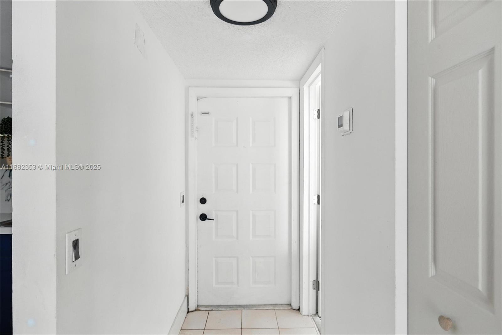 4165 Southwest 66th Terrace, Unit 109 Davie, FL 33314 - Photo 4 of 31 a bathroom with a granite countertop shower