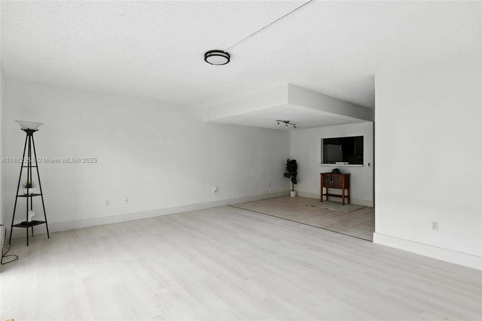 4165 Southwest 66th Terrace, Unit 109 Davie, FL 33314 - Photo 10 of 31 a view of a livingroom with furniture and a ceiling fan