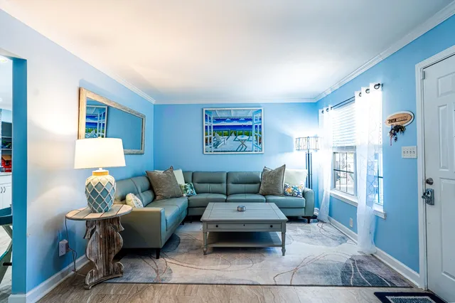 a living room with furniture and a rug