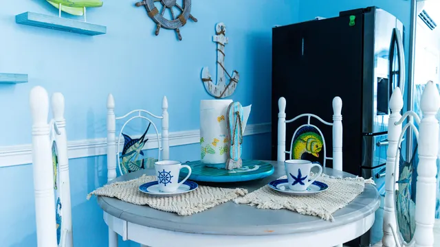 a dining room with furniture a kitchen view and kitchen view