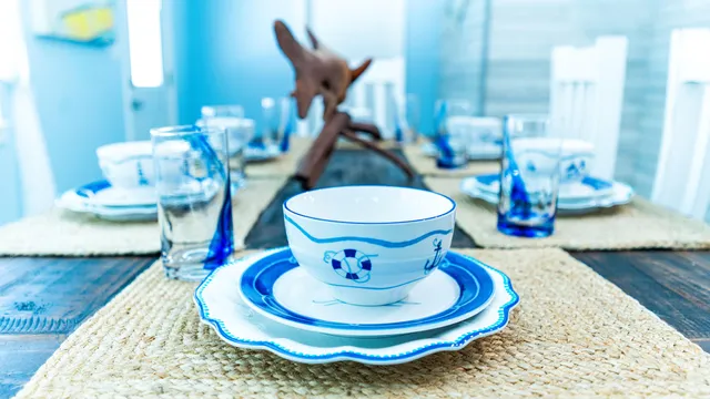 a bathroom with a toilet and a mirror