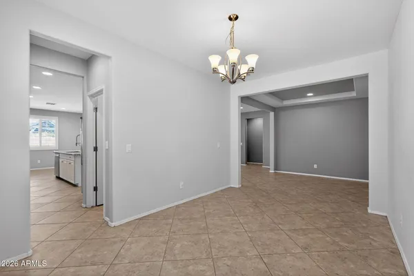 an empty room with a ceiling fan and a window