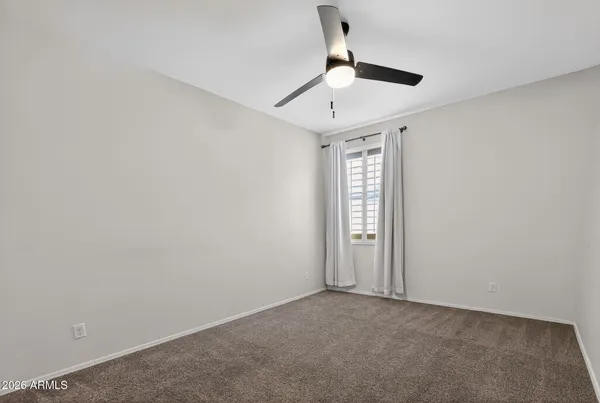 a bathroom with a tub a sink and a large mirror