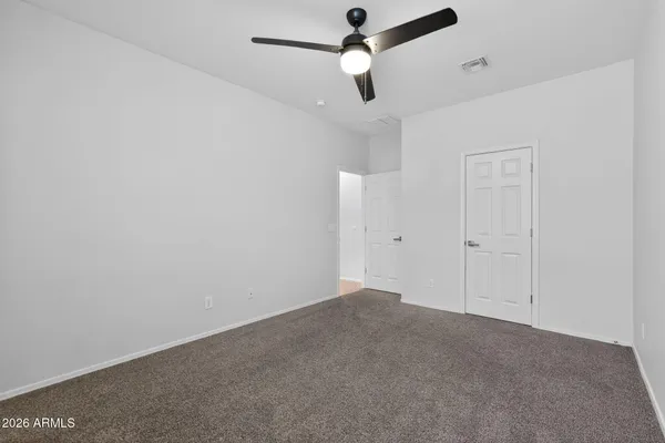 a spacious bathroom with a double vanity sink a mirror and a bathtub