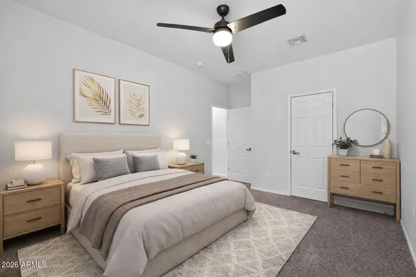a spacious bathroom with a double vanity sink a mirror and a bathtub