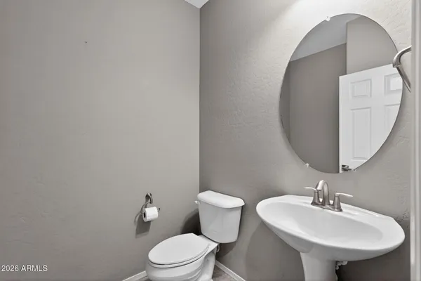 a view of an house with backyard and a patio