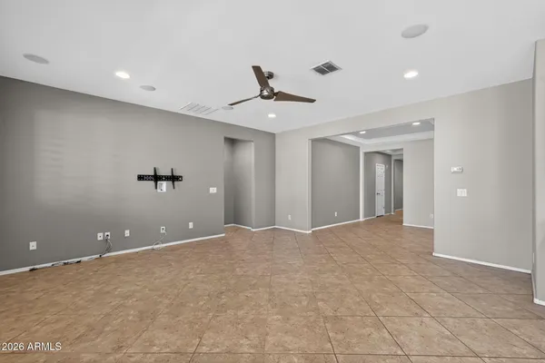 a kitchen with kitchen island granite countertop a stove a sink a counter space and cabinets