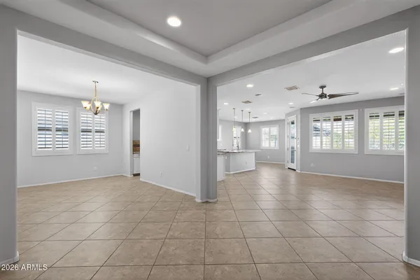 a kitchen with kitchen island granite countertop a sink a counter top space appliances and cabinets