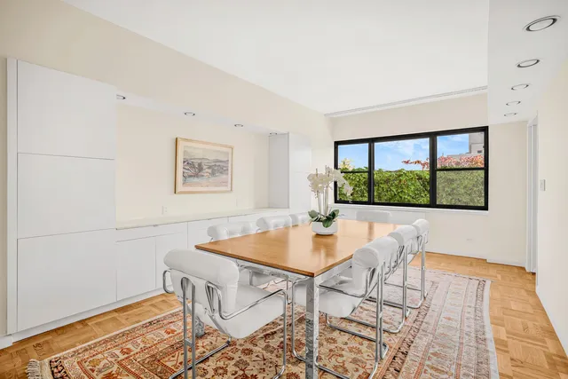 a view of city from balcony with furniture