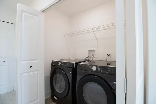 a view of a storage & utility room with washer and dryer